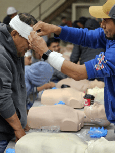 First aid training wrapping a head injury