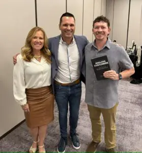 CPR Choice owners Cheryl and Travis Smith with keynote speaker Marcus Sheridan and his book Endless Customers at the Heartstream AED conference