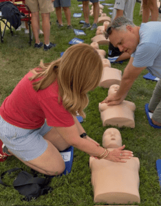 Cheryl helping teach CPR