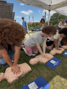 Practicing CPR under tents